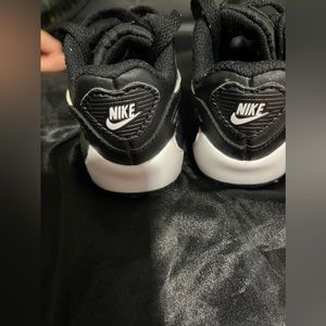 Nike baby sneakers air Size 4c color black with white excellent used condition.